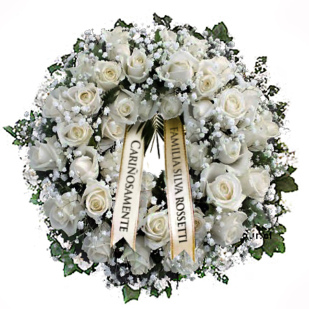Corona de flores para funeral confeccionada con rosas y otras flores de complemento, con dos cintas para escribir el nombre de quien envía y frase de condolencia.